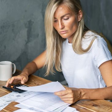 Person at desk reviewing financial statements.