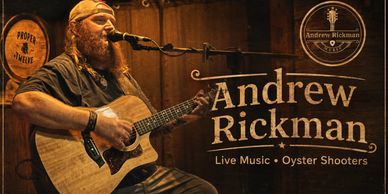 Andrew Rickman performing live music with acoustic guitar.
