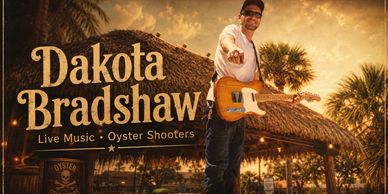 Dakota Bradshaw performing live with guitar at a tropical venue.