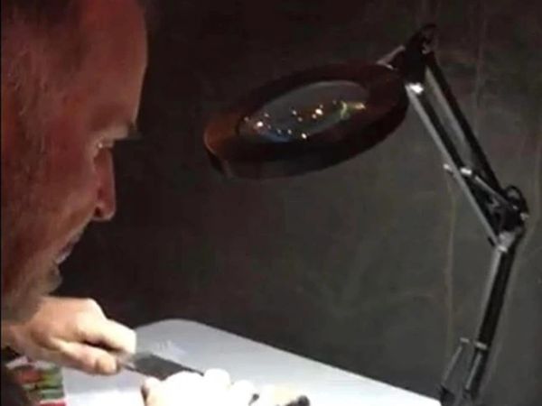 Gary Weber sharpening a kitchen knife.