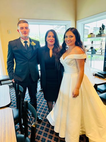 Wedding officiant and newlywed.