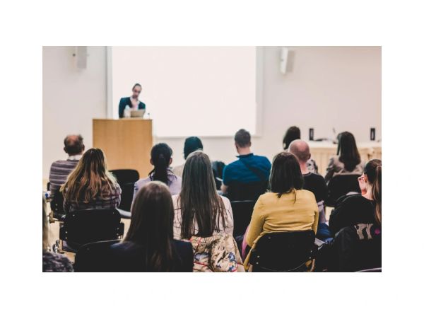 Audience listening to a speaker during a presentation.