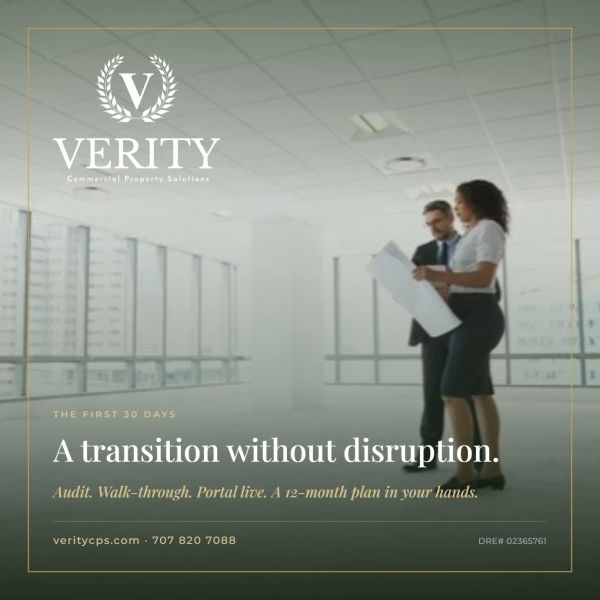 Two professionals review plans in a bright office space for smooth commercial property transitions.