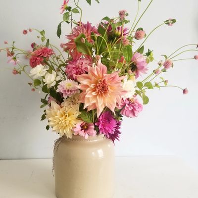 Dahlias and clover from our organic practices micro farm in a vintage french crock.