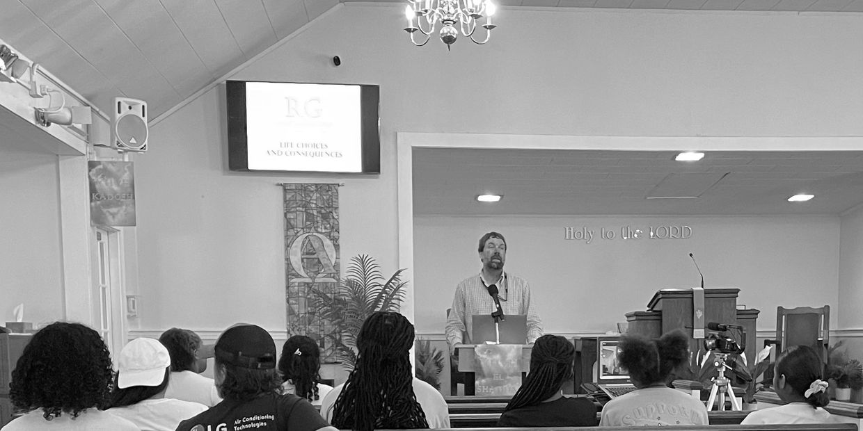 Speaker addressing audience in a church setting.
