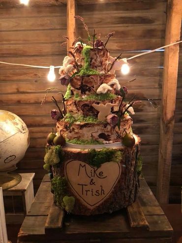 A wedding cake with fruits and flowers 