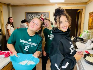 Eastern Michigan University Gymnastics team celebrates their team with a retreat at the Ovid Inn Event Center