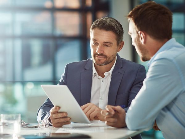 Two business people working together in an office