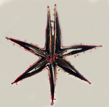 A star-shaped lighting fixture with exposed bulbs.