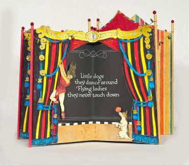 Vintage puppet theater with a dancing dog illustration.