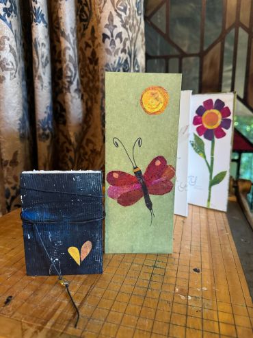 Handmade cards featuring butterfly and flower designs.