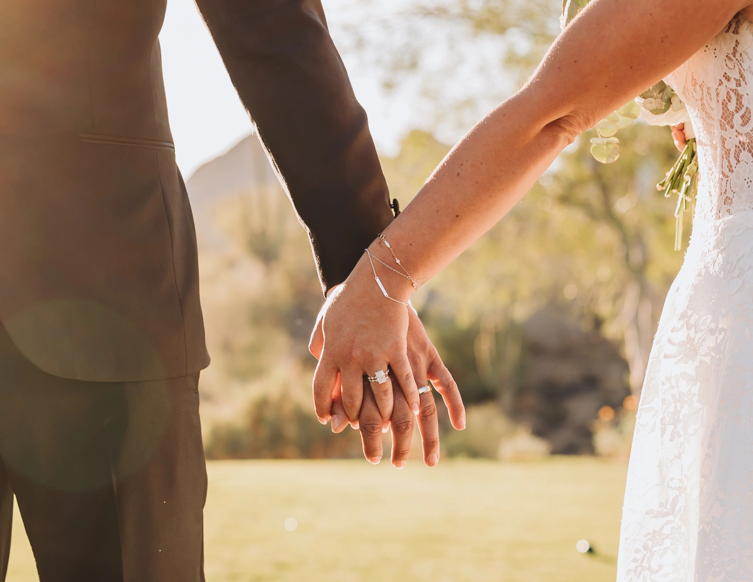 Bride and groom holding hands on their wedding day.