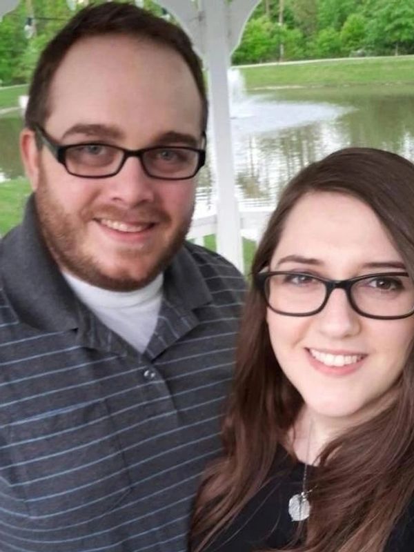 A man and woman standing next to each other.