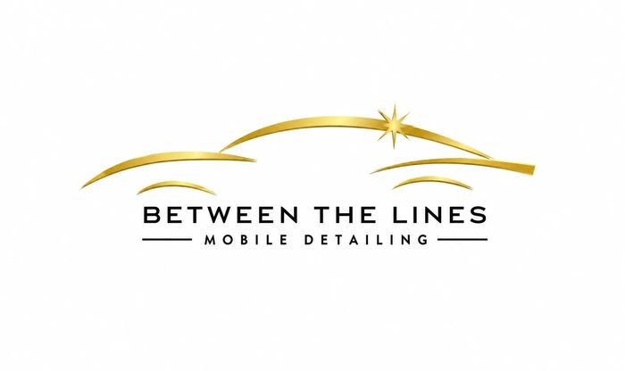 Logo for Between The Lines Mobile Detailing with a sleek gold car outline.