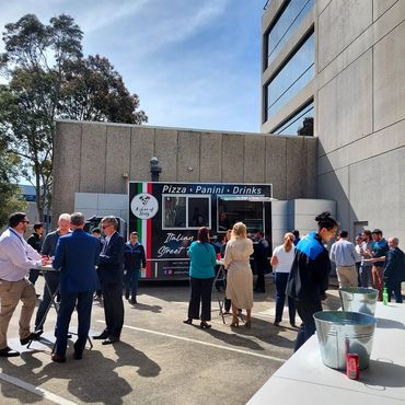 A Slice of Italy Sydney pizza food truck catering for a corporate event, serving freshly made Italia