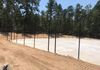 Dozer work cutting slopes and grades at tennis court complex