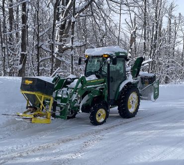 John Deere tractor snowblowing in OroMedonte and Orillia