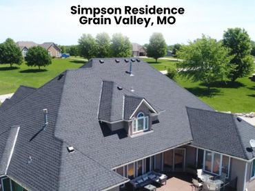 A large house with a spacious outdoor deck in Grain Valley, MO.