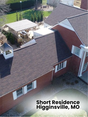 Aerial view of a brick residence with a patio and pergola in Higginsville, MO.