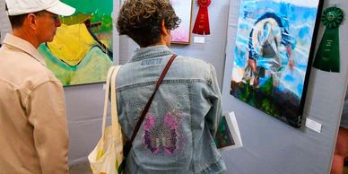 image  of artists viewing show artwork