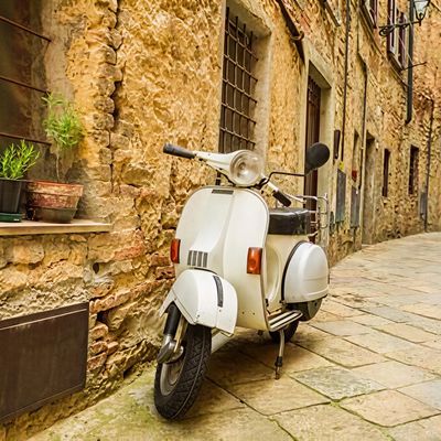 White scooter in Italian alley.