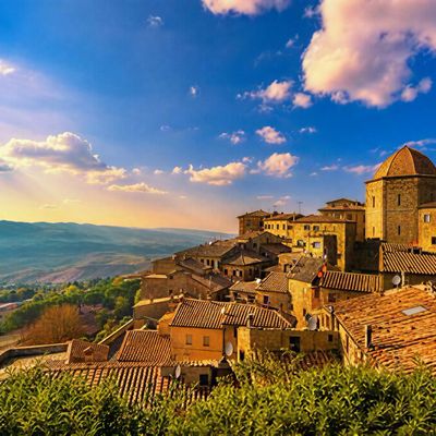 Sunset over Tuscan hilltop village.
