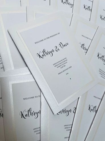 Set of wedding 'Order of Service' booklets, with diamond embellishments.