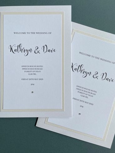A pair of wedding 'Order of Service' booklets, with diamond embellishments.