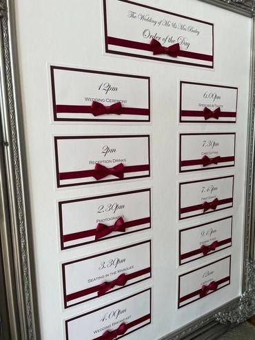 Order of the Day Wedding Sign in a large Silver Frame, complete with Red Ribbons and Bows