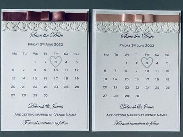 2 White, Save the Date Invitations with Red and Pink ribbons and white lace embellishment.
