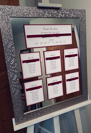 Wedding Table/Seating Plan with Red Ribbons mounted on a mirrored Silver Frame.