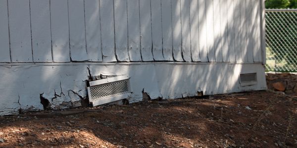 Photo of building with dry rot, in disrepair