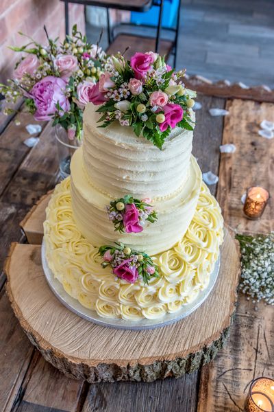 
"An edible masterpiece, adorned with intricate details and sweet elegance, stunning wedding cake