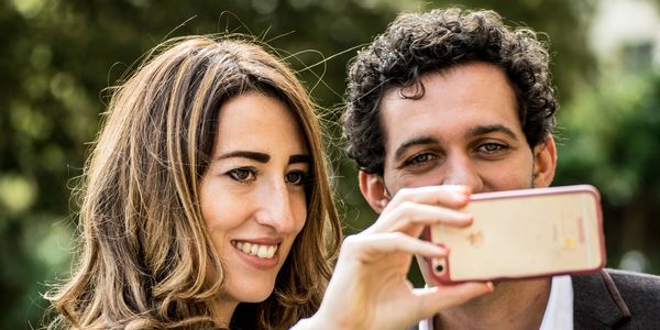 the wedding guests take a cheeky selfie at Pittsville pump rooms in Cheltenham Wedding Photographer