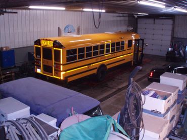 Yellow school bus getting a state inspection.