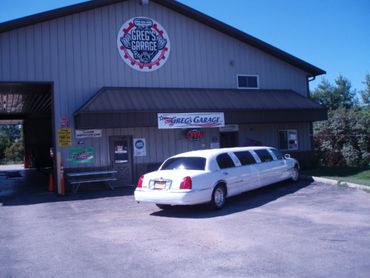 A front entrance view of Greg's Garage on a sunny day.