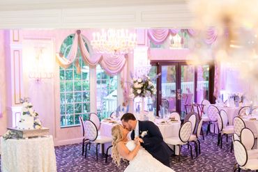 Bride and groom dancing at wedding reception.