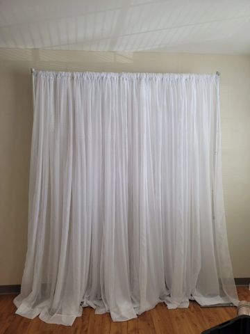 White sheer drape event backdrop