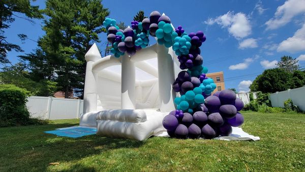 Garland on White house bounce combo with slide for a birthday party