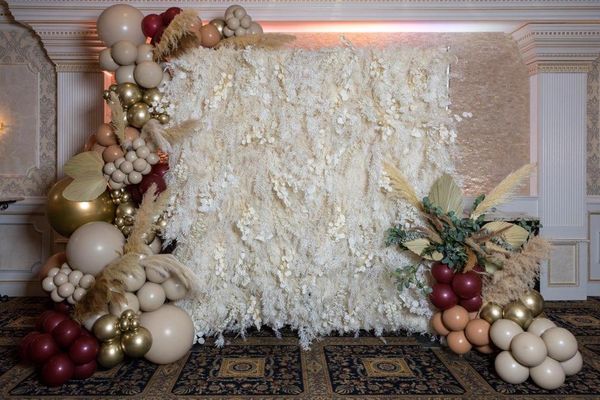 Dried Flower Wall with luxury balloon garland, pampas grass, fan palms and eucalyptus