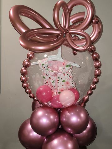Newborn onesie stuffed inside balloon as a welcome baby gift, baby shower gift, balloon delivery