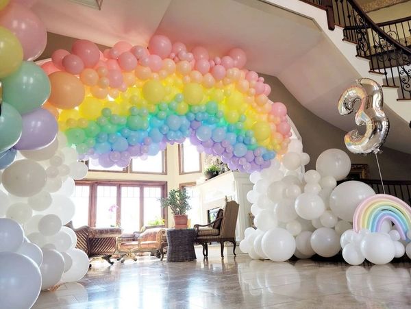 Organic rainbow balloon arch