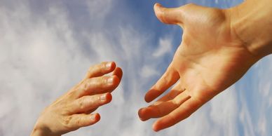 One hand reaching for another, for help.  Credit: pub_nvc, flickr.com