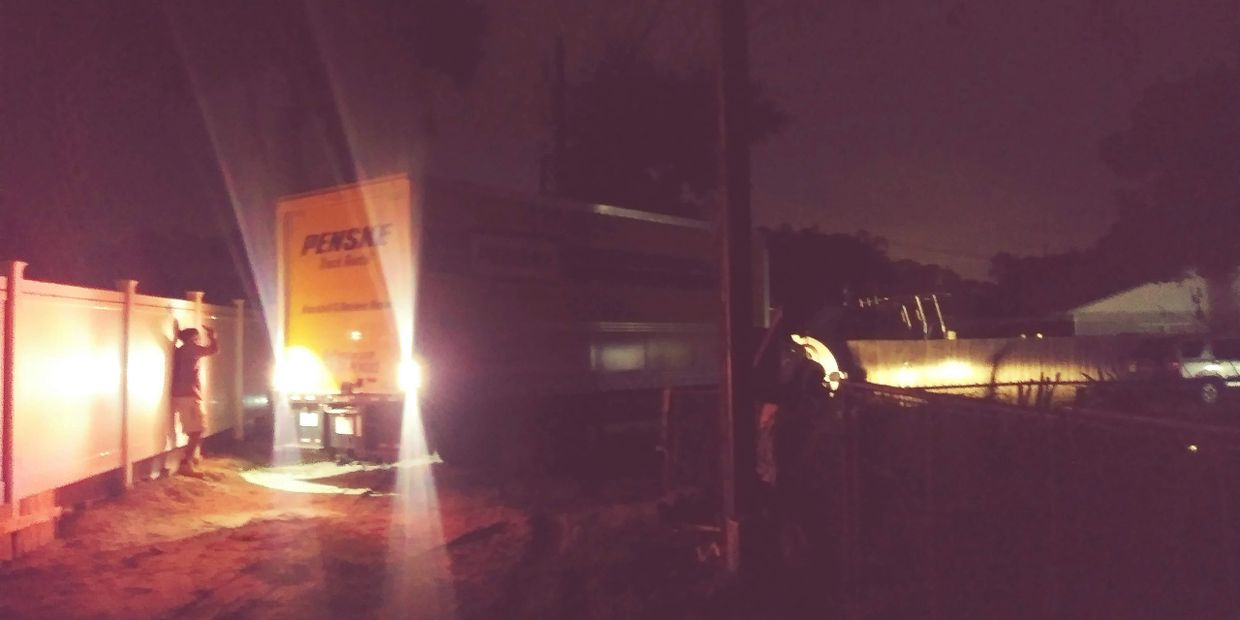 Veterans Moving Help loading a Penske rental truck at night for a last-minute Gainesville Florida cu