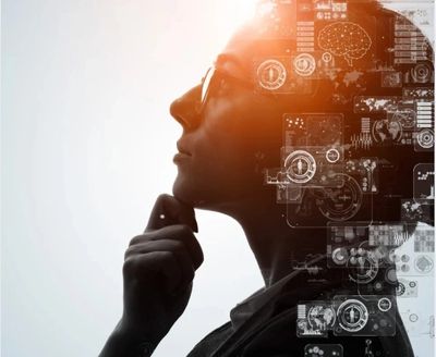 Silhouette of a person deep in thought with digital brain overlays.