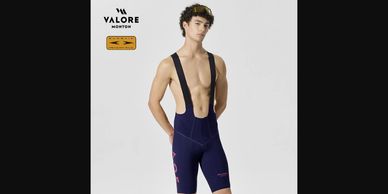 Male model wearing a navy Valore cycling bib shorts with suspenders.