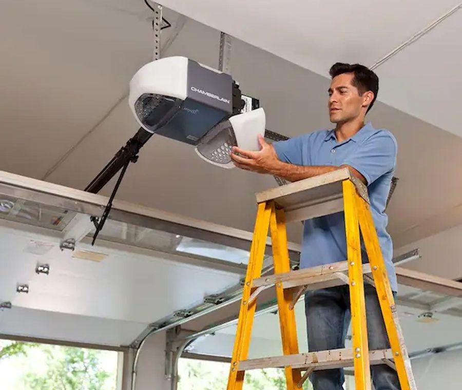 Technician working on a garage door opener