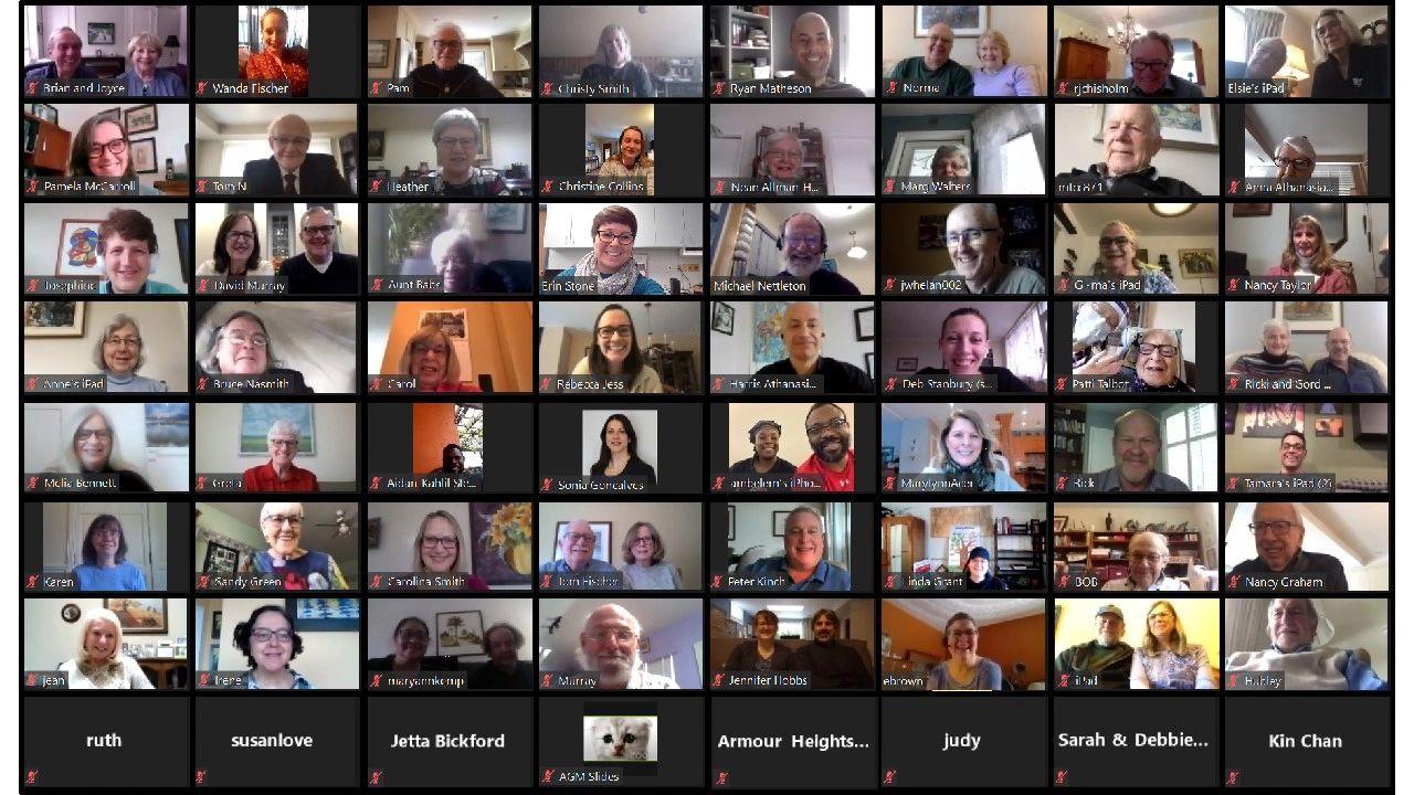A large virtual meeting with diverse participants on Zoom.
