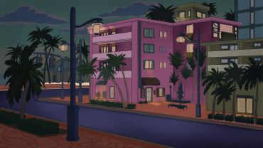 Nighttime city street with illuminated purple building and palm trees.