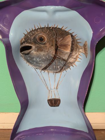 Surreal painting of a pufferfish as a hot air balloon on a purple chair.